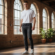 DIESEL D-Eetar 069DV W29/L30 vyriški džinsai su siaurėjančiomis plėšytomis detalėmis, juodi su sagomis.