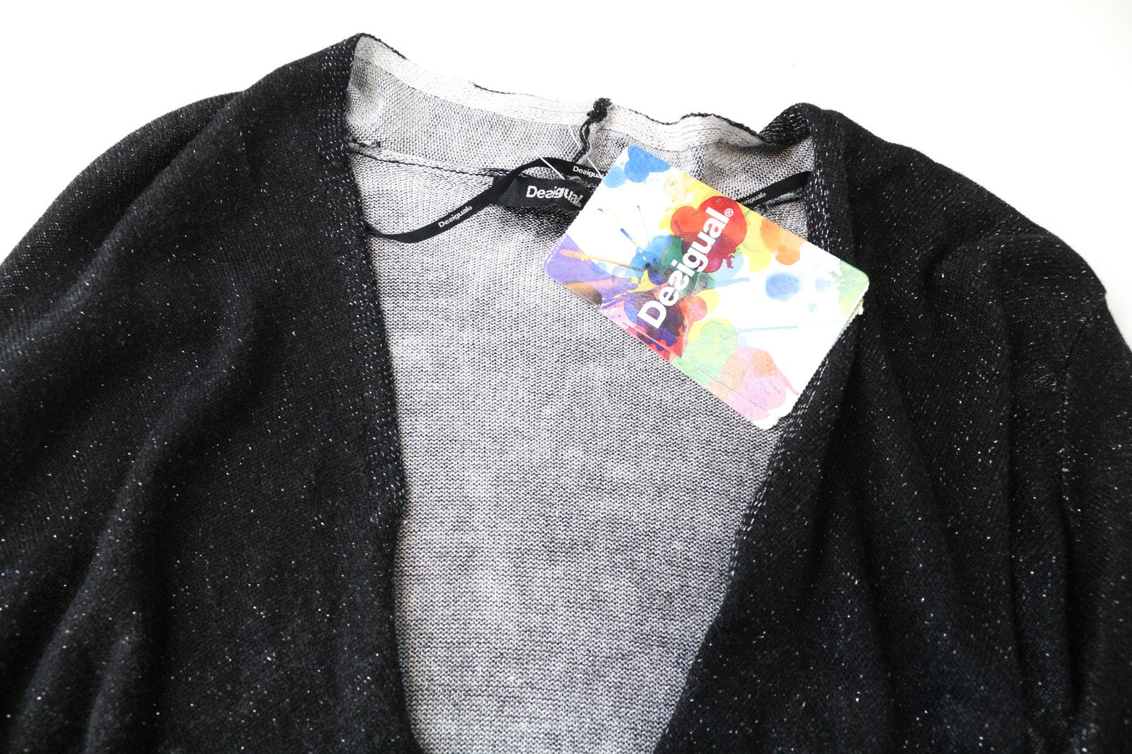 DESIGUAL Baku moteriškas džemperis pilkas juodas raštuotas blizgantis V formos iškirptės viršus XS 