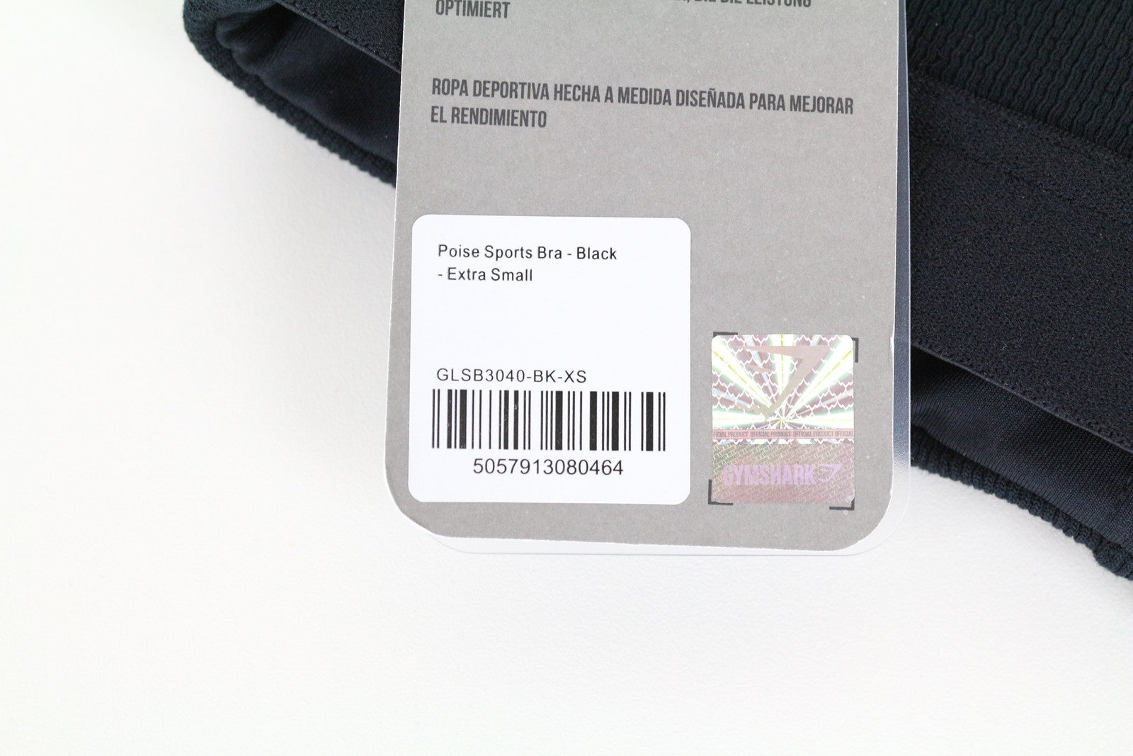 GYMSHARK XS Poise sportinė liemenėlė, juoda, tampri, be rankovių, su kryžminėmis petnešėlėmis 