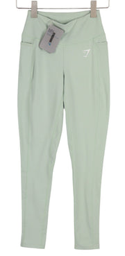 GYMSHARK Svajingos moteriškos tamprės XS dydžio sportinės kelnės, pistacijų žalios, tamprios, sauso kirpimo 