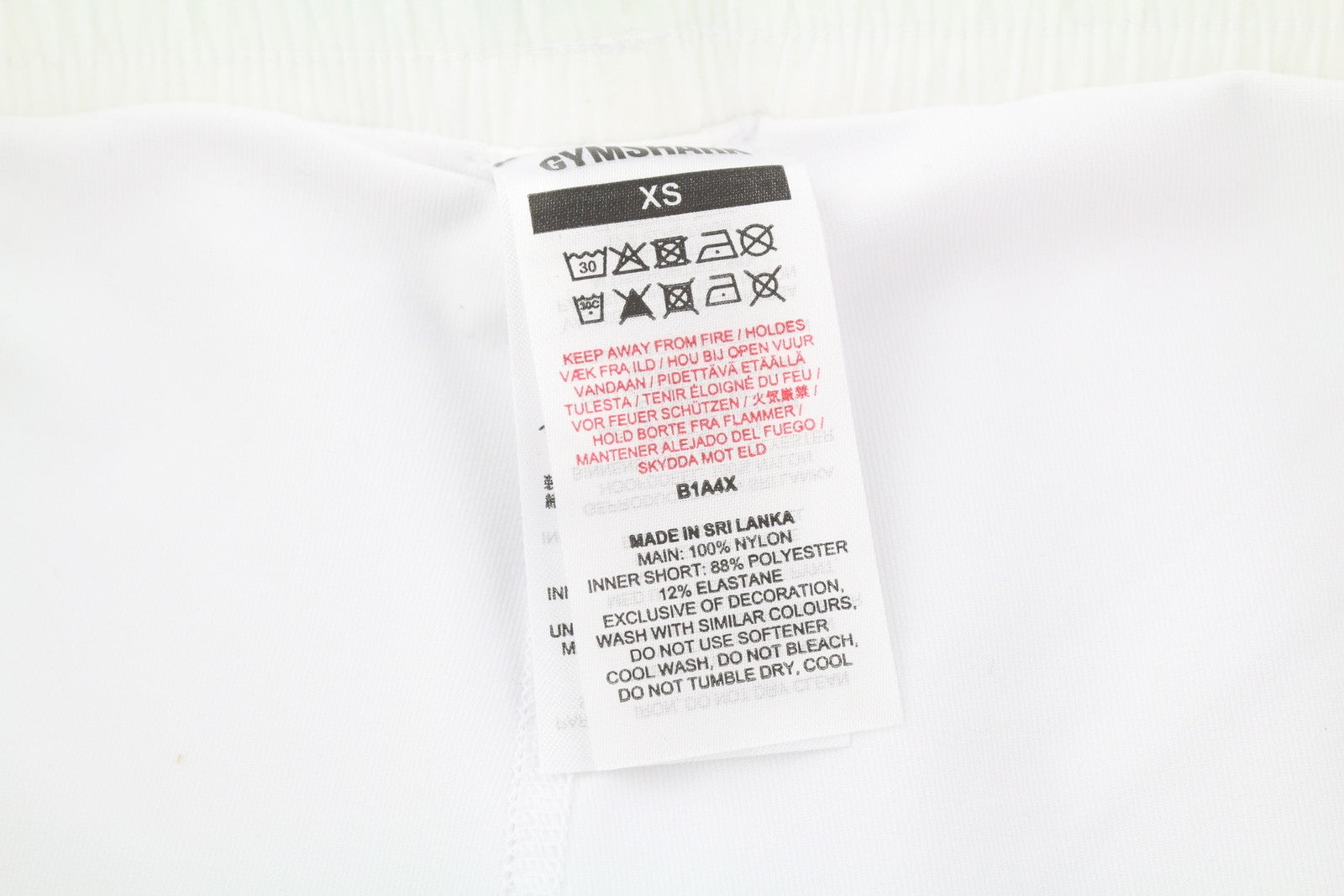 GYMSHARK Pulse moteriški šortai XS dydžio, balti, 2in1, suformuota nugara, vidutinio liemens juosmuo, reguliuojamas juosmuo. 