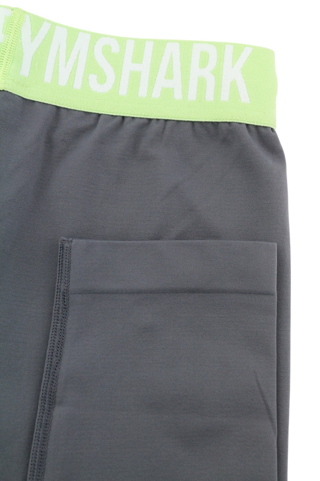 GYMSHARK GLLG4276 moteriškos tamprės XS dydžio, besiūlės, trumpos, žemo juosmens, tamprios, pilkos spalvos 