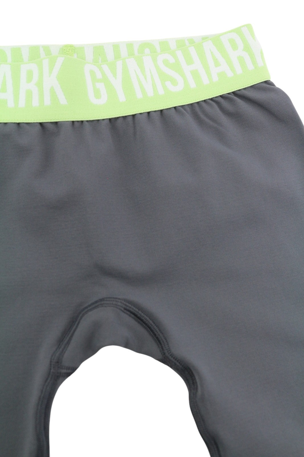 GYMSHARK GLLG4276 moteriškos tamprės XS dydžio, besiūlės, trumpos, žemo juosmens, tamprios, pilkos spalvos 