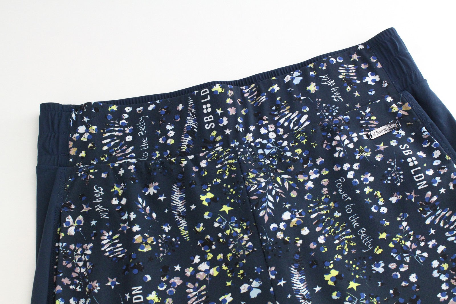 SWEATY BETTY moteriškos XS dydžio mėlynos raštuotos tamprios sportinės kelnės su užtraukiamais gobtuvais 