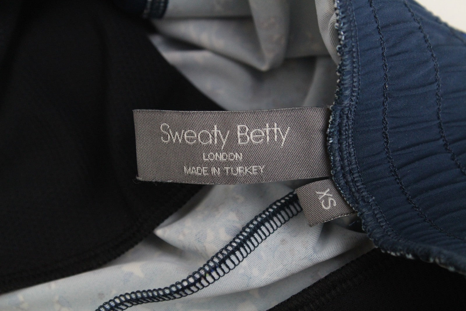 SWEATY BETTY moteriškos XS dydžio mėlynos raštuotos tamprios sportinės kelnės su užtraukiamais gobtuvais 