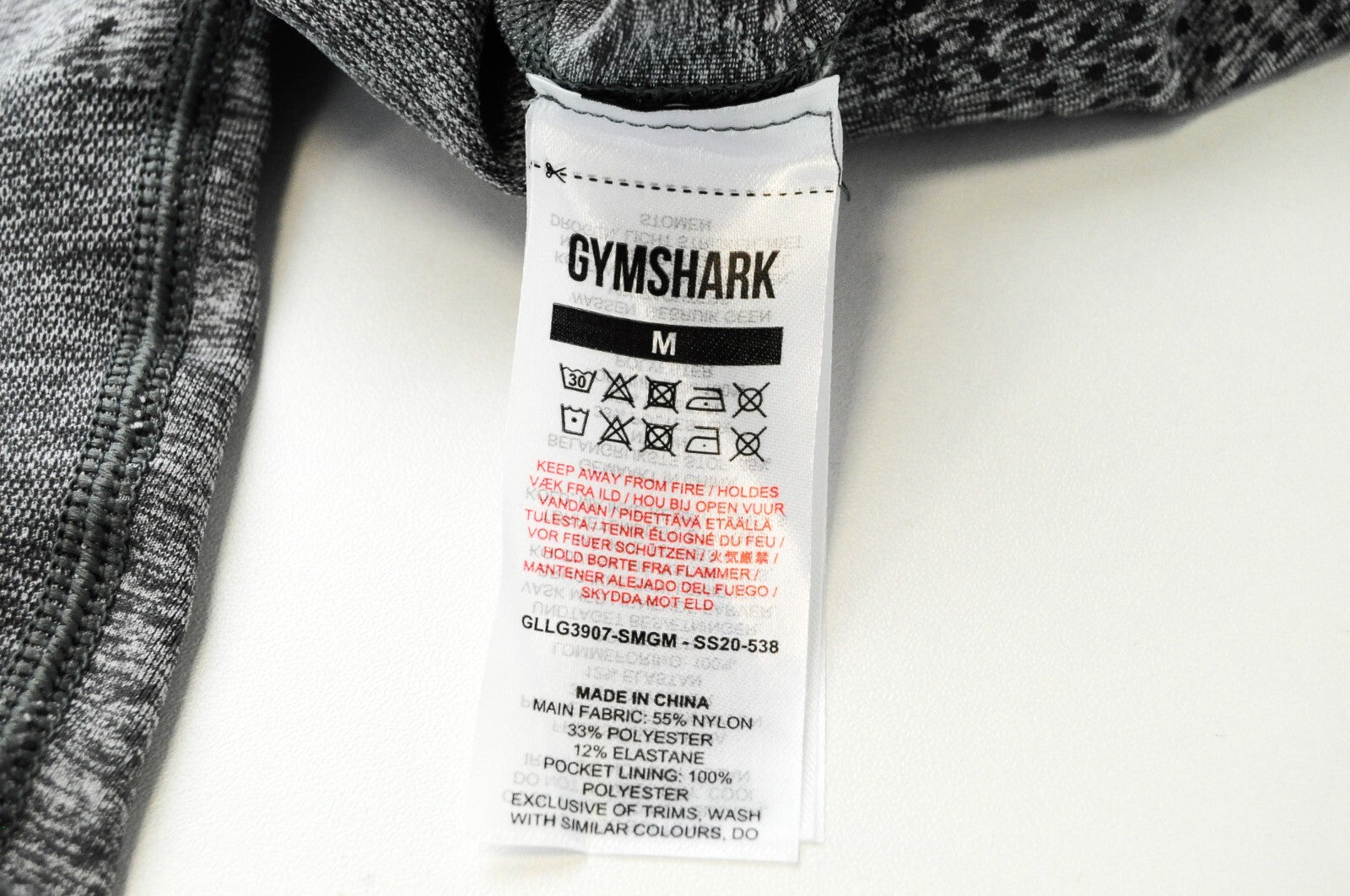 GYMSHARK moteriškos pilkos M dydžio sportinės tamprės su logotipu ir užtrauktuku bei kišenėmis 