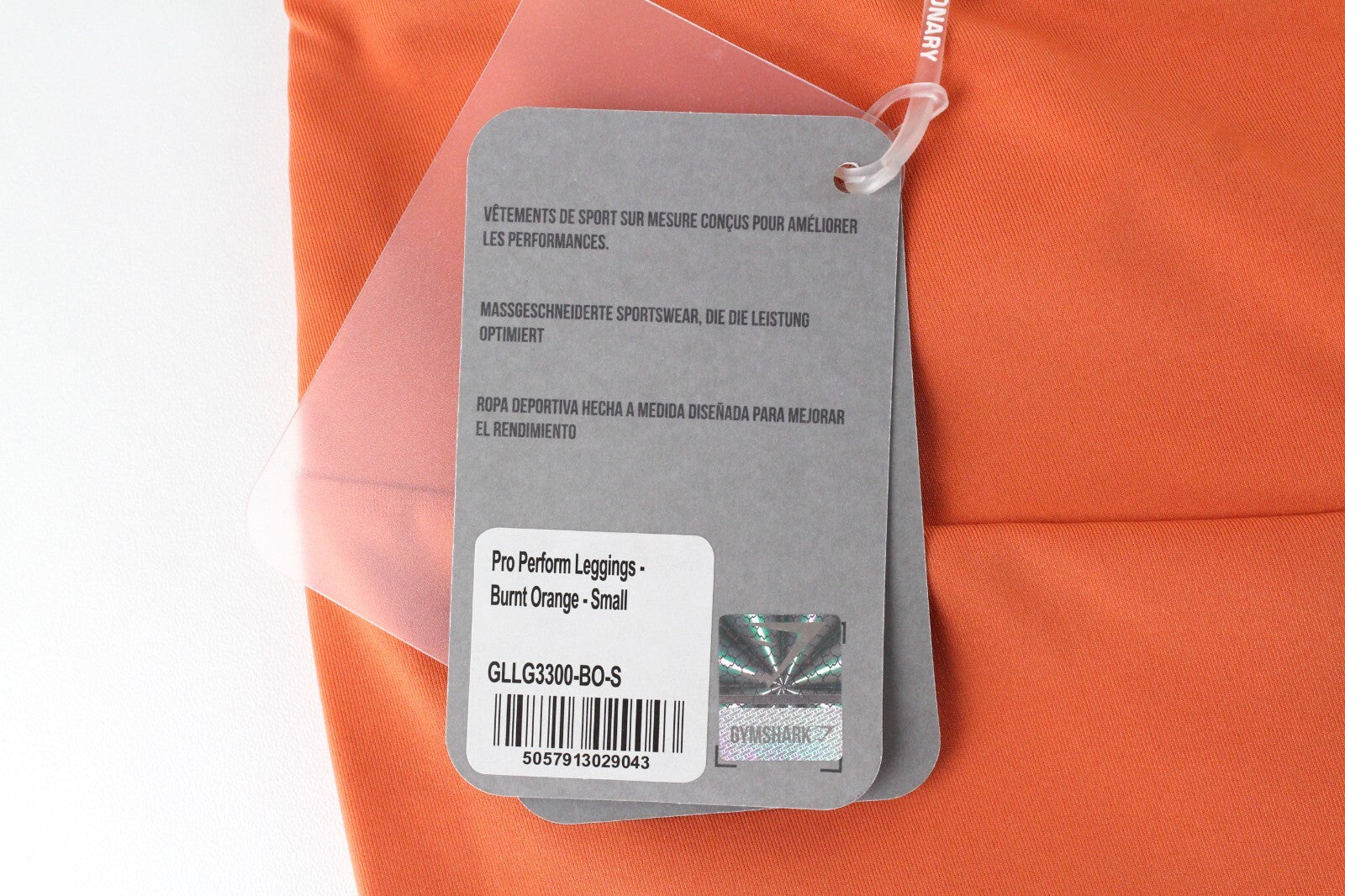 GYMSHARK Pro Perform moteriškos tamprės su oranžine logotipu ir sportine apranga 