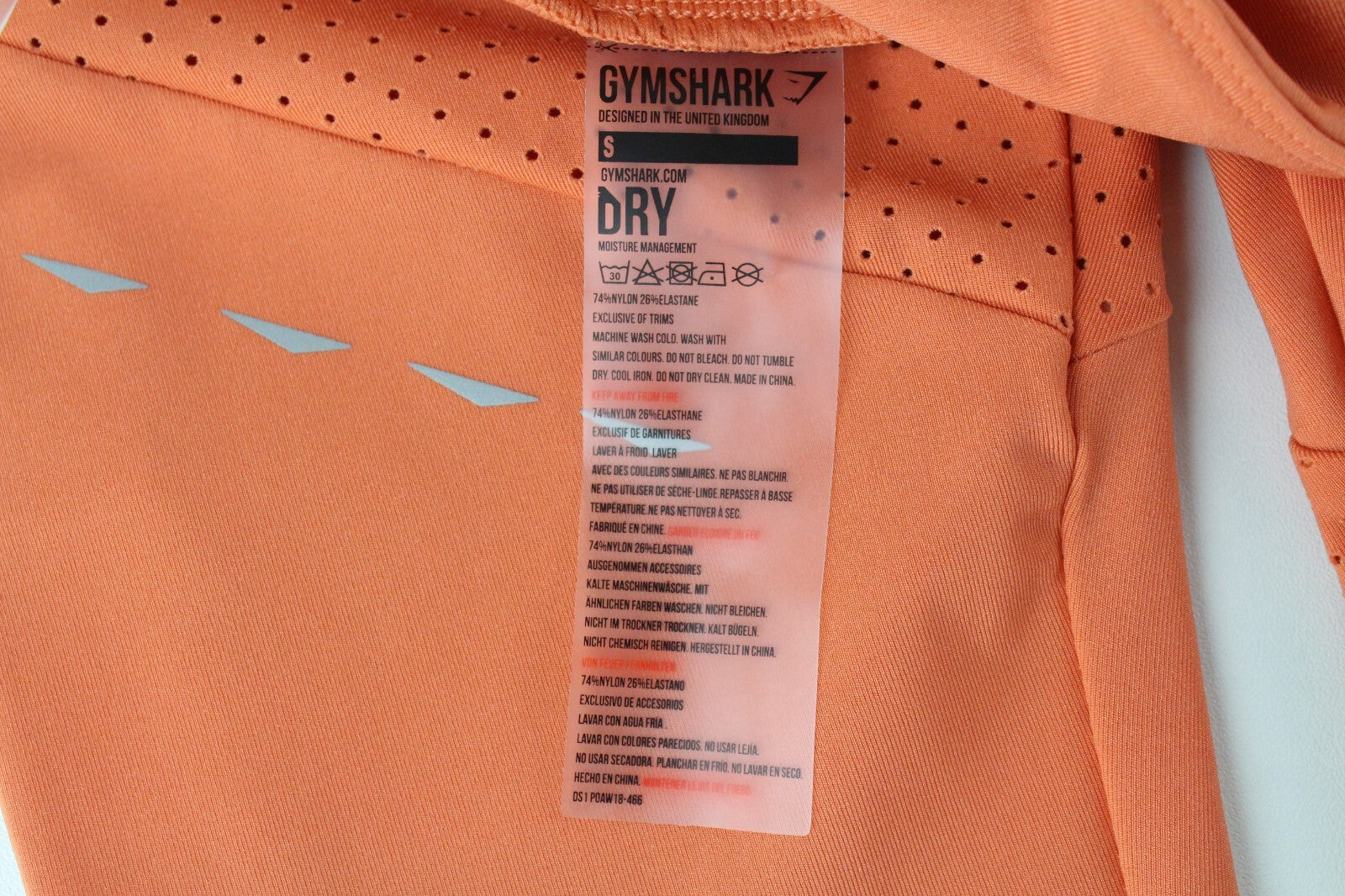 GYMSHARK Pro Perform moteriškos tamprės su oranžine logotipu ir sportine apranga 