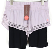 SWEATY BETTY 2in1 šortai S violetiniai juodi moteriški sluoksniuoti sportiniai tamprūs sportiniai drabužiai 