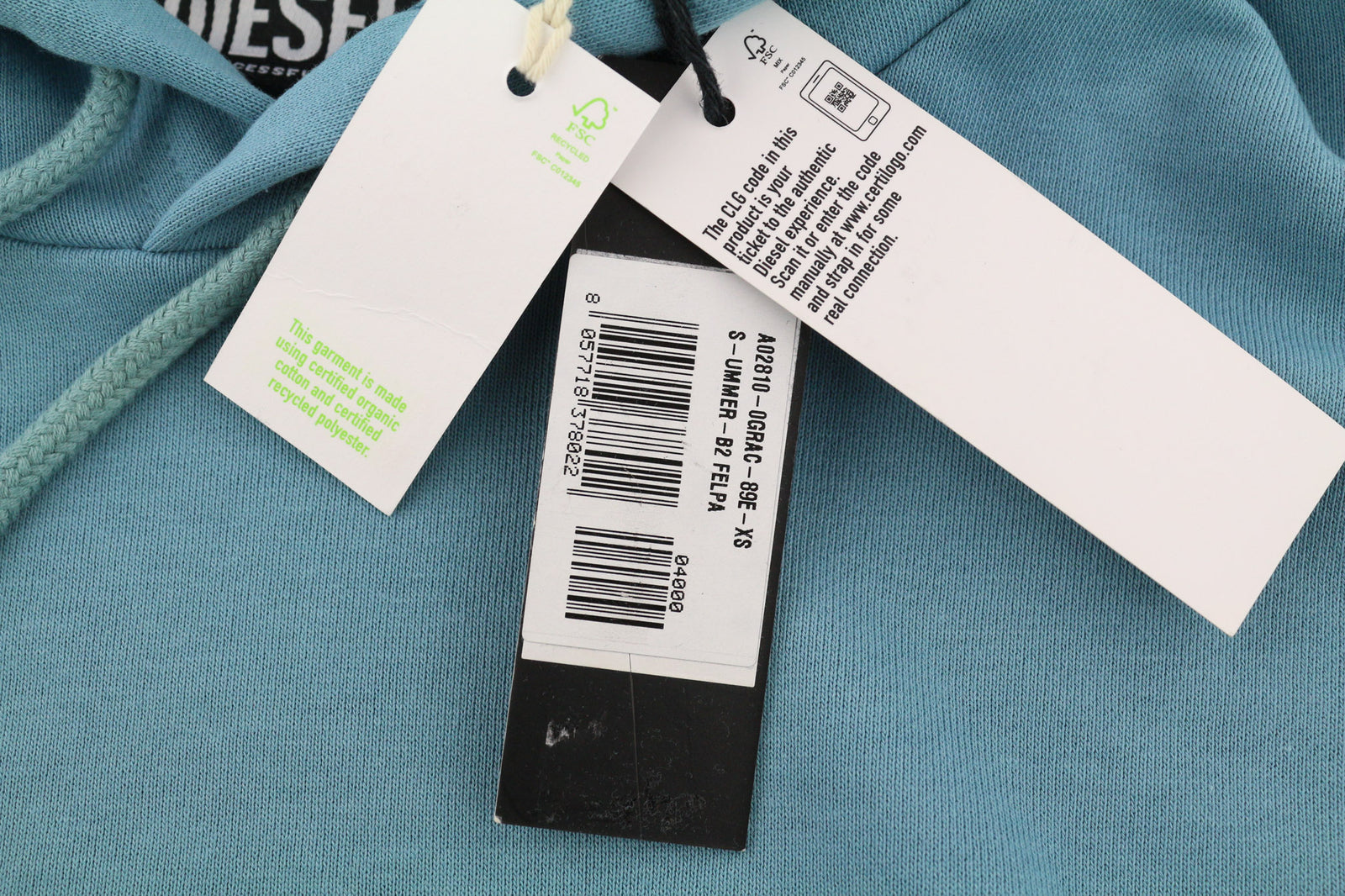 DIESEL S-Ummer-B2 unisex džemperis su gobtuvu XS dydžio, mėlynas megztinis su kengūros kišene ir dirželiu, rekomenduojama kaina – 150 € 