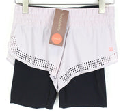 SWEATY BETTY Aerial 2in1 moteriški šortai XS, violetiniai, juodi, tamprūs, daugiasluoksniai, sportiniai 