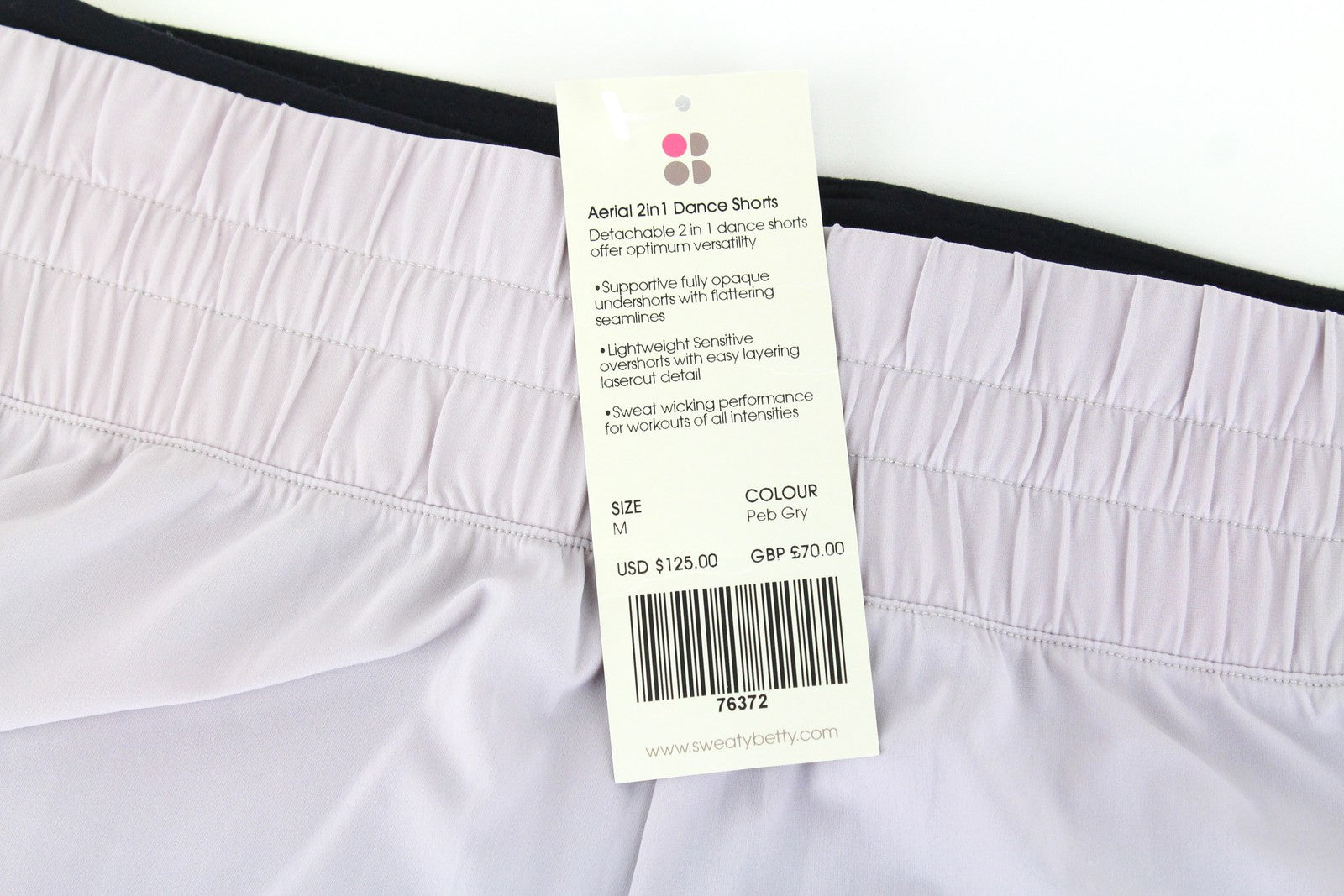 SWEATY BETTY Aerial 2in1 moteriški šortai M violetiniai juodi sportinės aprangos tamprūs logotipai 