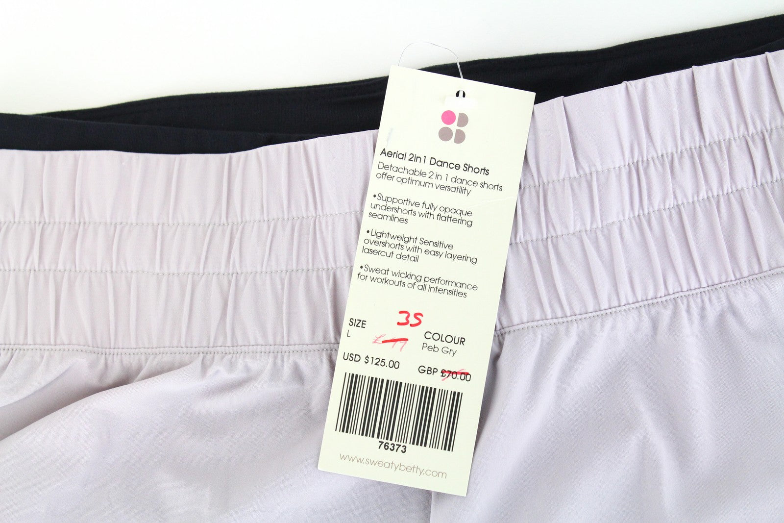 SWEATY BETTY Aerial 2in1 moteriški šortai L dydžio, violetiniai, juodi, sportinio logotipo tamprūs. 