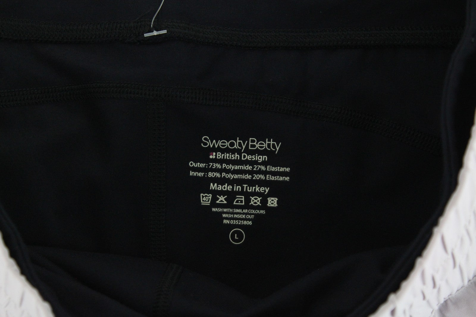 SWEATY BETTY Aerial 2in1 moteriški šortai L dydžio, violetiniai, juodi, sportinio logotipo tamprūs. 