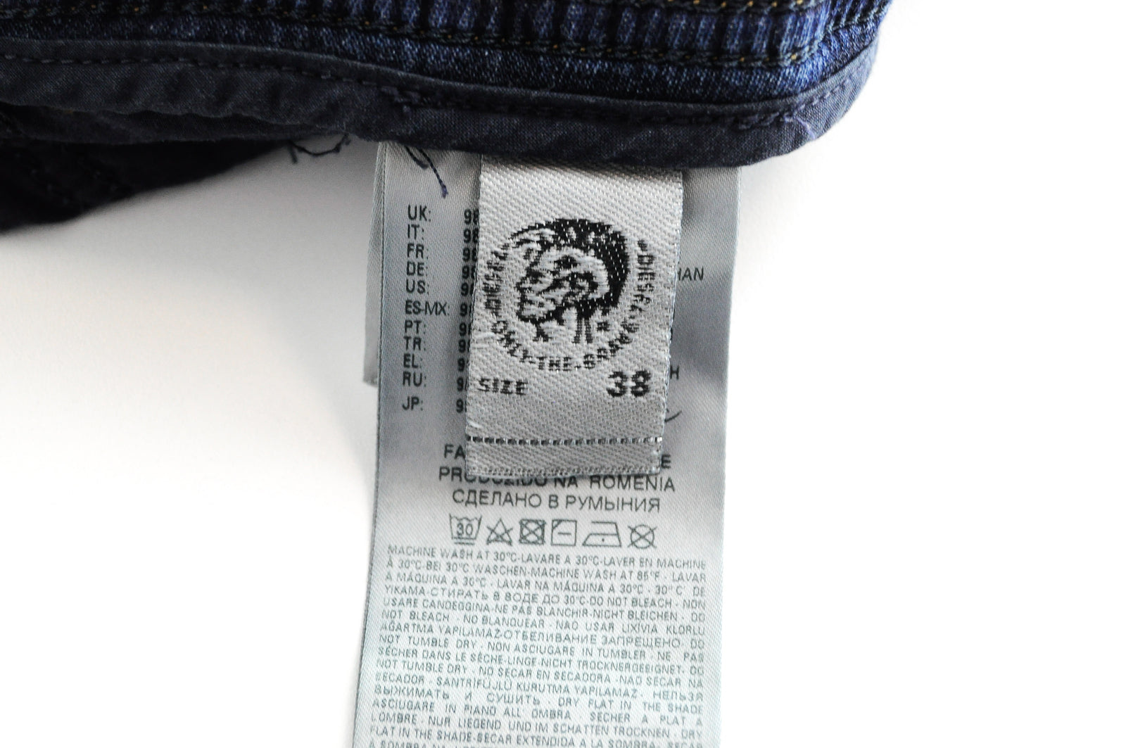 DIESEL Krooley-NE 084TZ W38 vyriški mėlyni siaurėjantys plėšyti tamprūs džinsai 