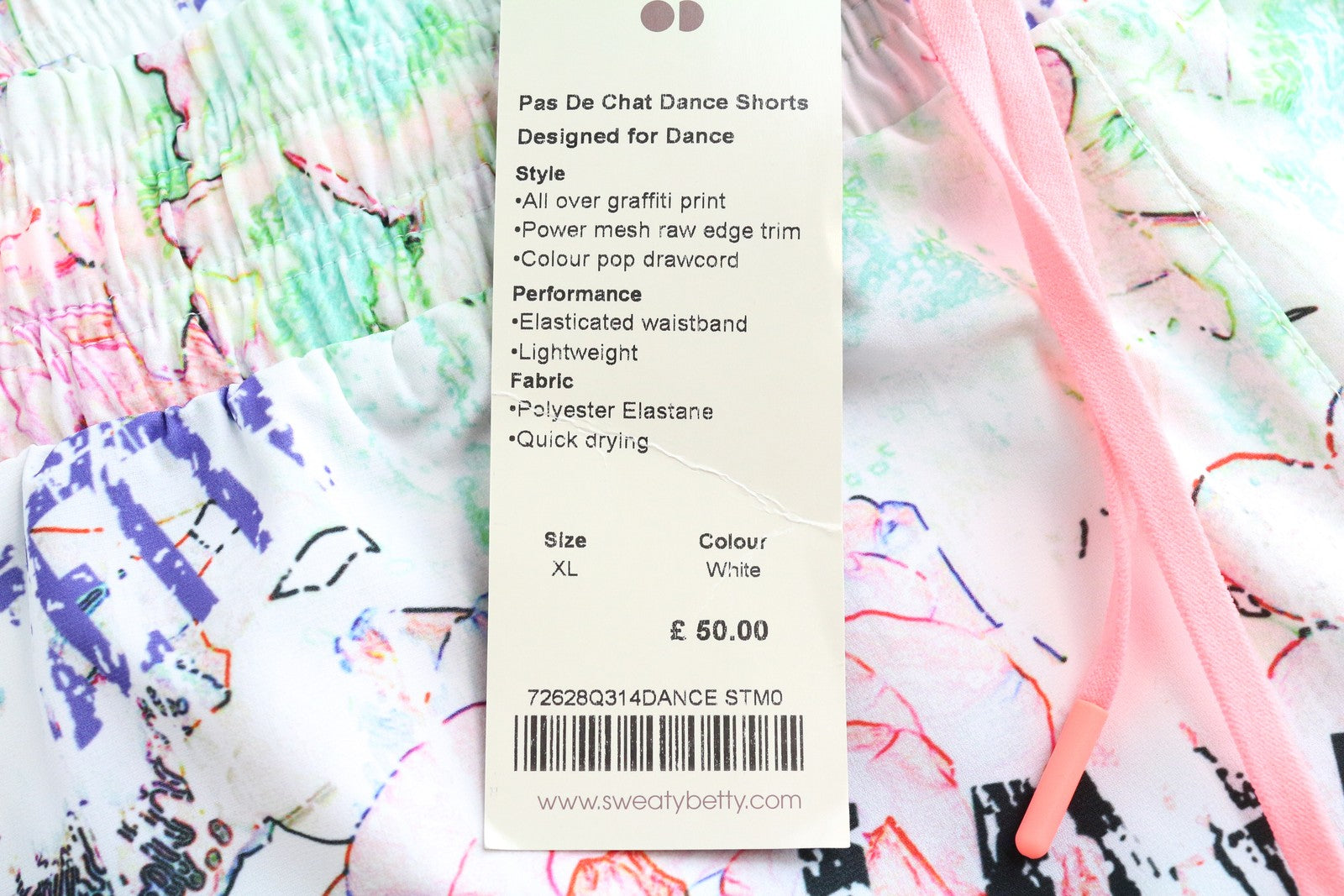 SWEATY BETTY Pas De Chat Dance moteriški šortai XL dydžio, balti, tamprūs, su grafiti raštais 