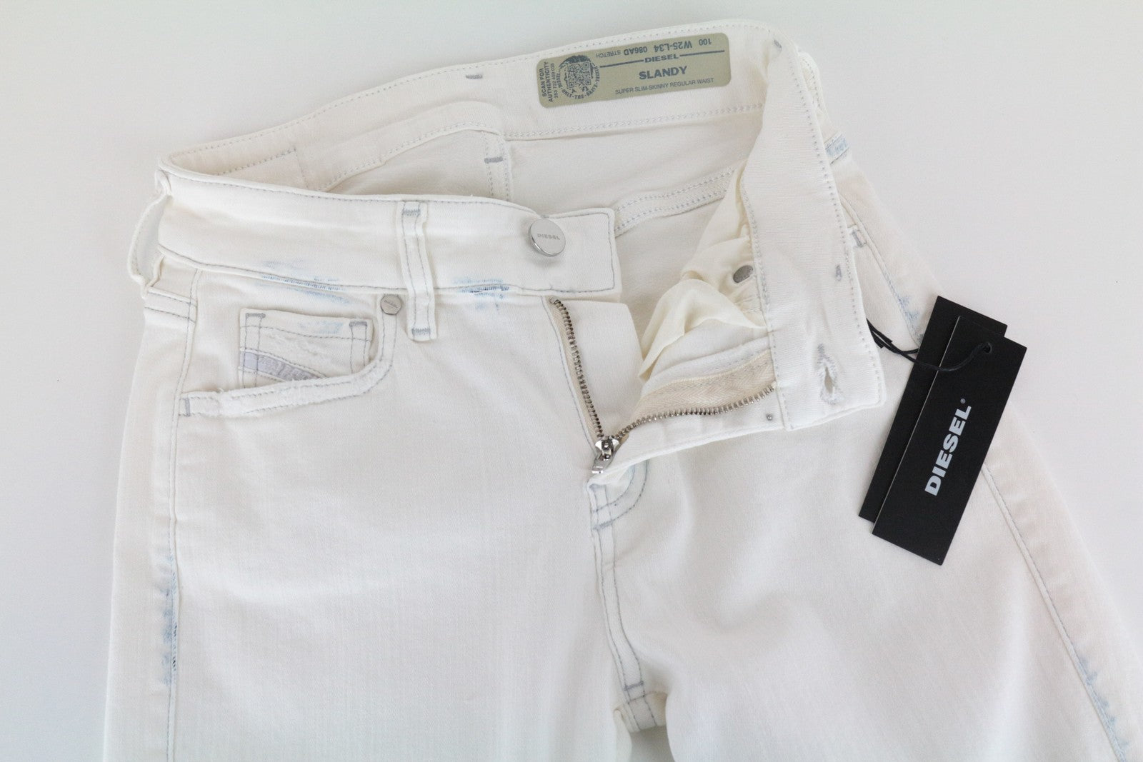 DIESEL Slandy 086AD moteriškos aptemptos džinsinės kelnės W26/L32 itin plonos, tamprios, baltos... 