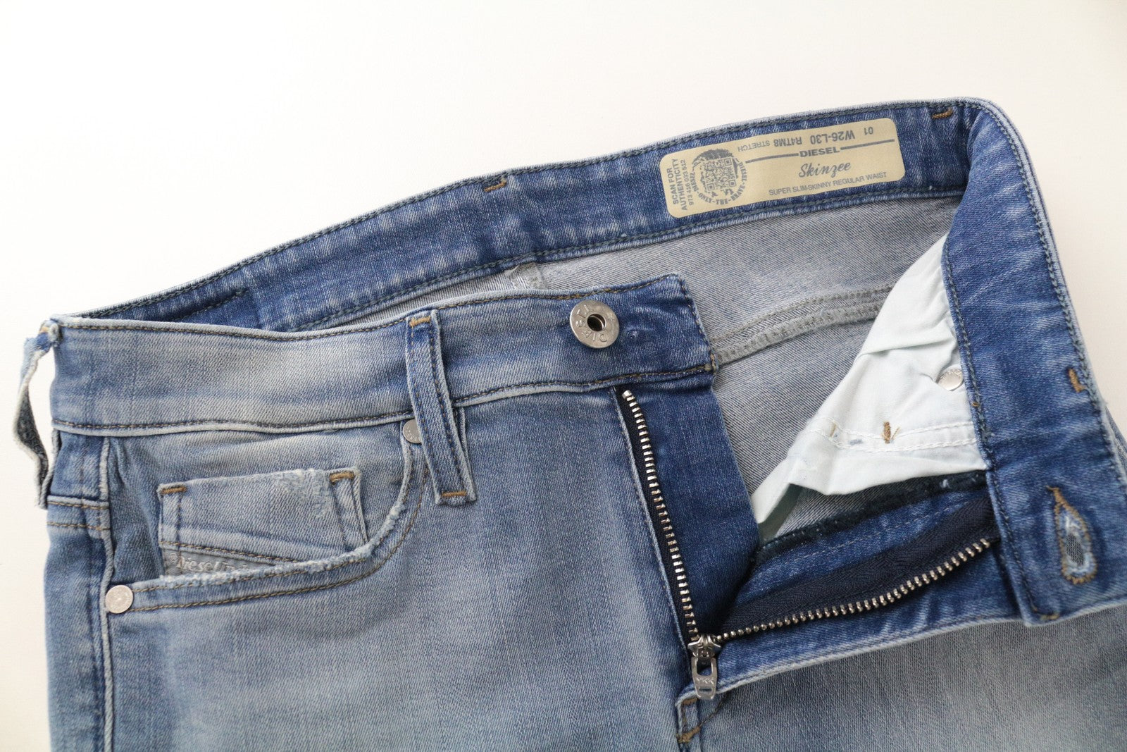 DIESEL Skinzee R4TM8 W26/L30 mėlyni plėšyti, ploni, aptempti moteriški džinsai 