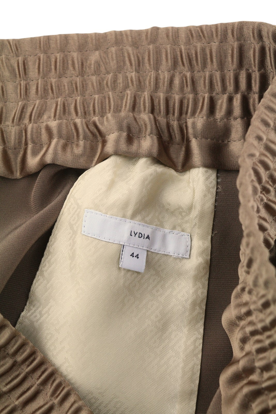 PT TORINO Lydia moteriškos kelnės, 44, rudos, blizgios, tamprios juosmens, platėjančios kišenės kojose. 