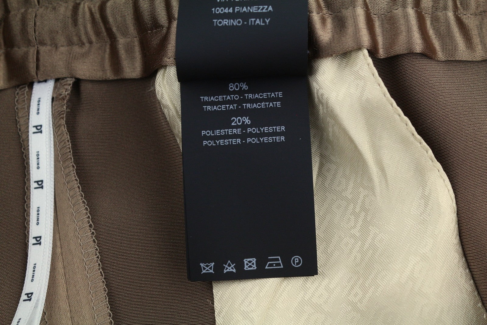 PT TORINO Lydia moteriškos kelnės, 44, rudos, blizgios, tamprios juosmens, platėjančios kišenės kojose. 