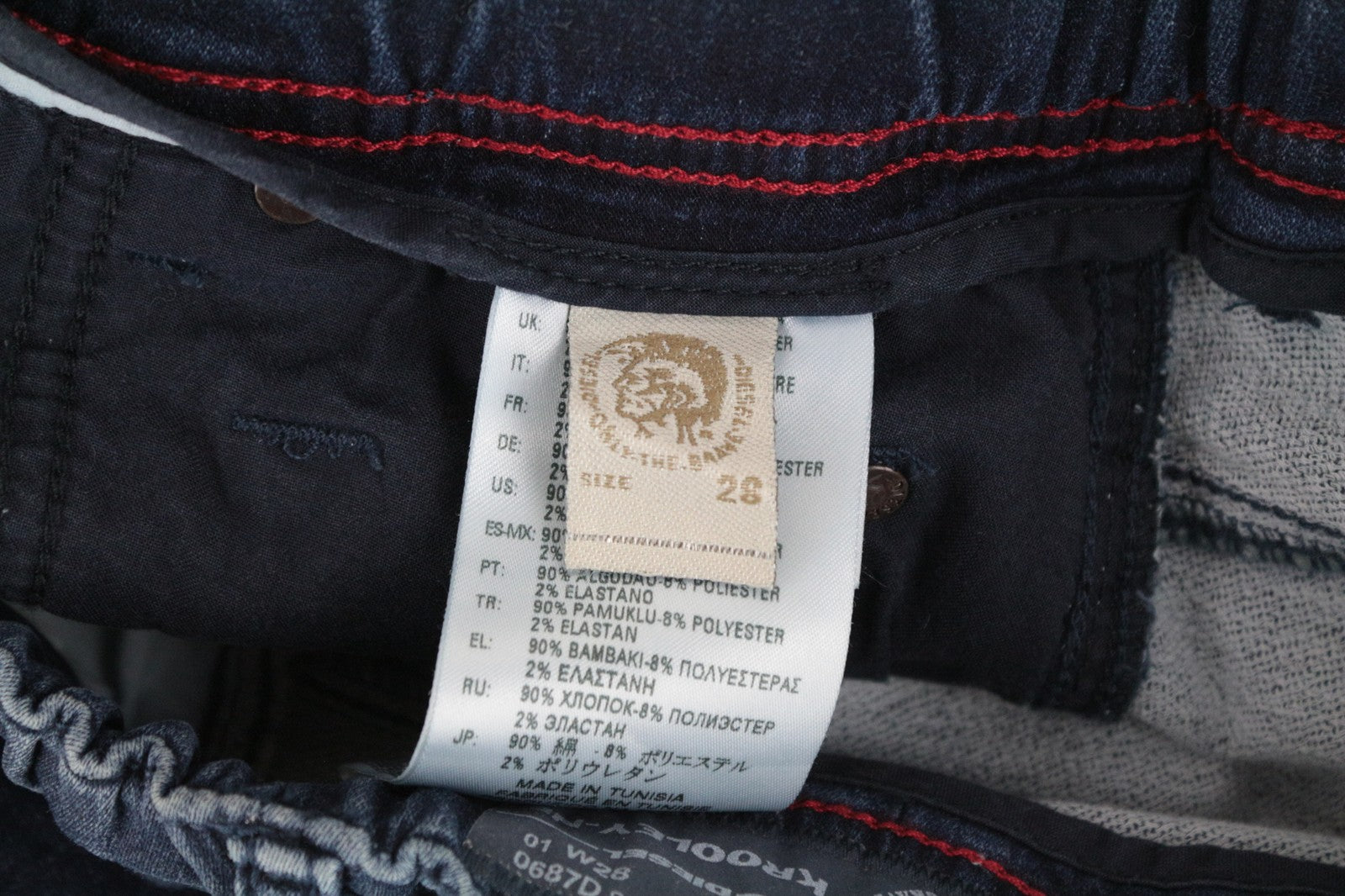 DIESEL Krooley-NE 0687D W28 vyriški džinsai su sportiniu snapeliu, siaurėjančios, kontrastingos mėlynos spalvos. 