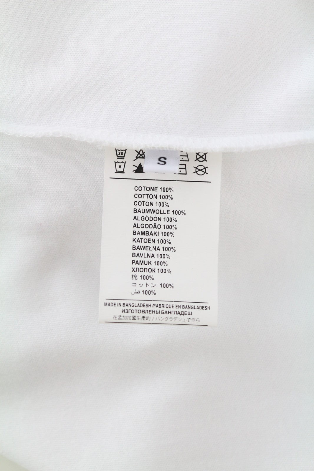 JOHN RICHMOND moteriški marškinėliai S dydžio, balti, su petukais, apvalūs, trumpomis rankovėmis priekyje 