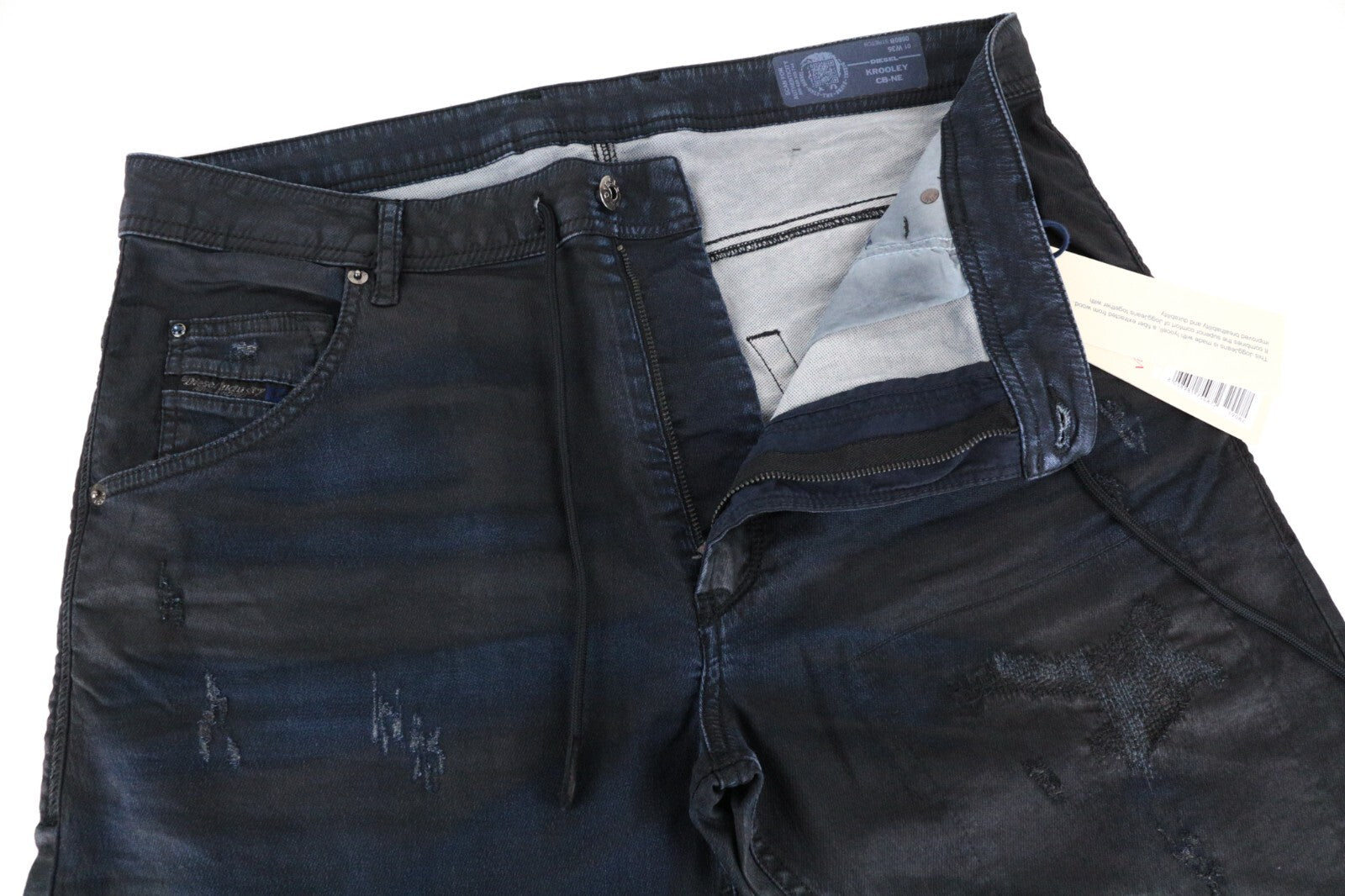 DIESEL Krooley-CB-NE 0680B W36 vyriški džinsai su lopais, siaurėjančiais vaškuotomis juostelėmis. 