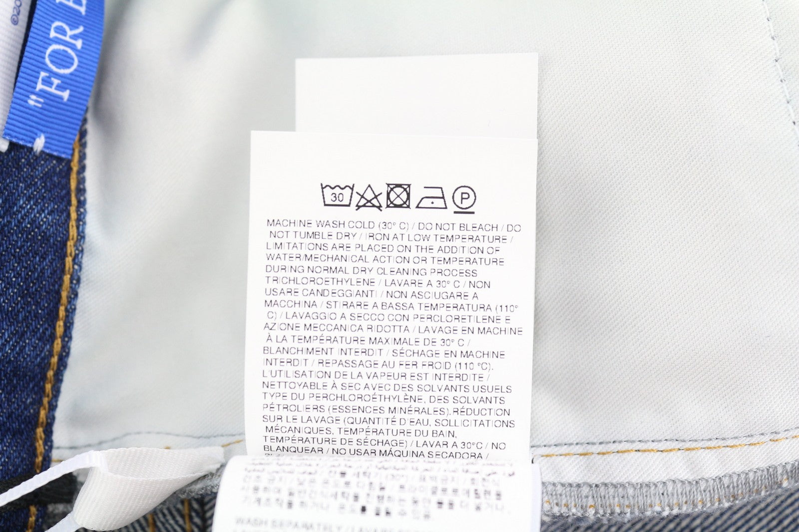 OFF-WHITE „Arr Skate“ vyriški džinsai W34 su mėlyna spalva, įprasto kirpimo, su sagomis, rekomenduojama kaina – 645 € 