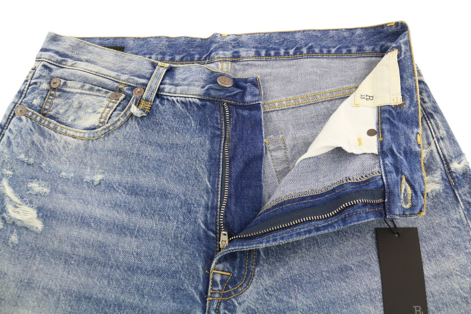 R13 „Boyfriend“ moteriškos džinsinės kelnės, 29 m., skalbti iki kulkšnies, trumpintos, „Distress Bain“ su plėšytomis kelnėmis. RMK 595 €. 