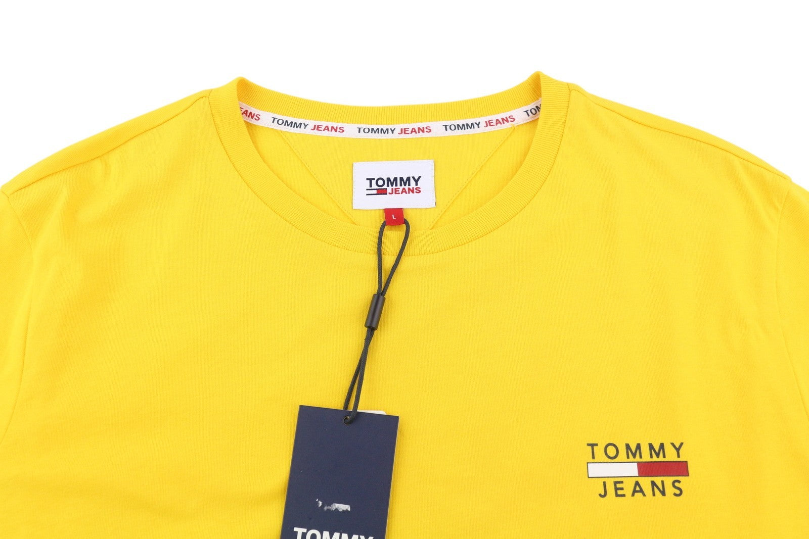 TOMMY HILFIGER TJM Chest Logo Pollen vyriški marškinėliai L dydžio, geltoni, trumpomis rankovėmis, apvalia kaklo iškirpte.