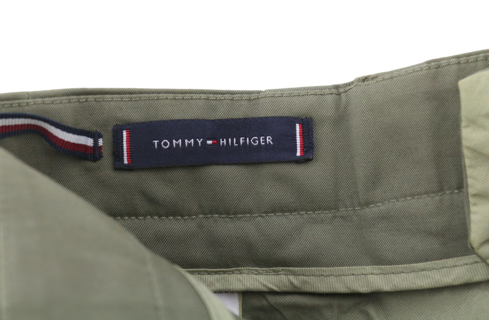 TOMMY HILFIGER Army Stretch Twill vyriškos kelnės W32 Khaki spalvos, klostuotos, siaurėjančios su užtrauktuku. 