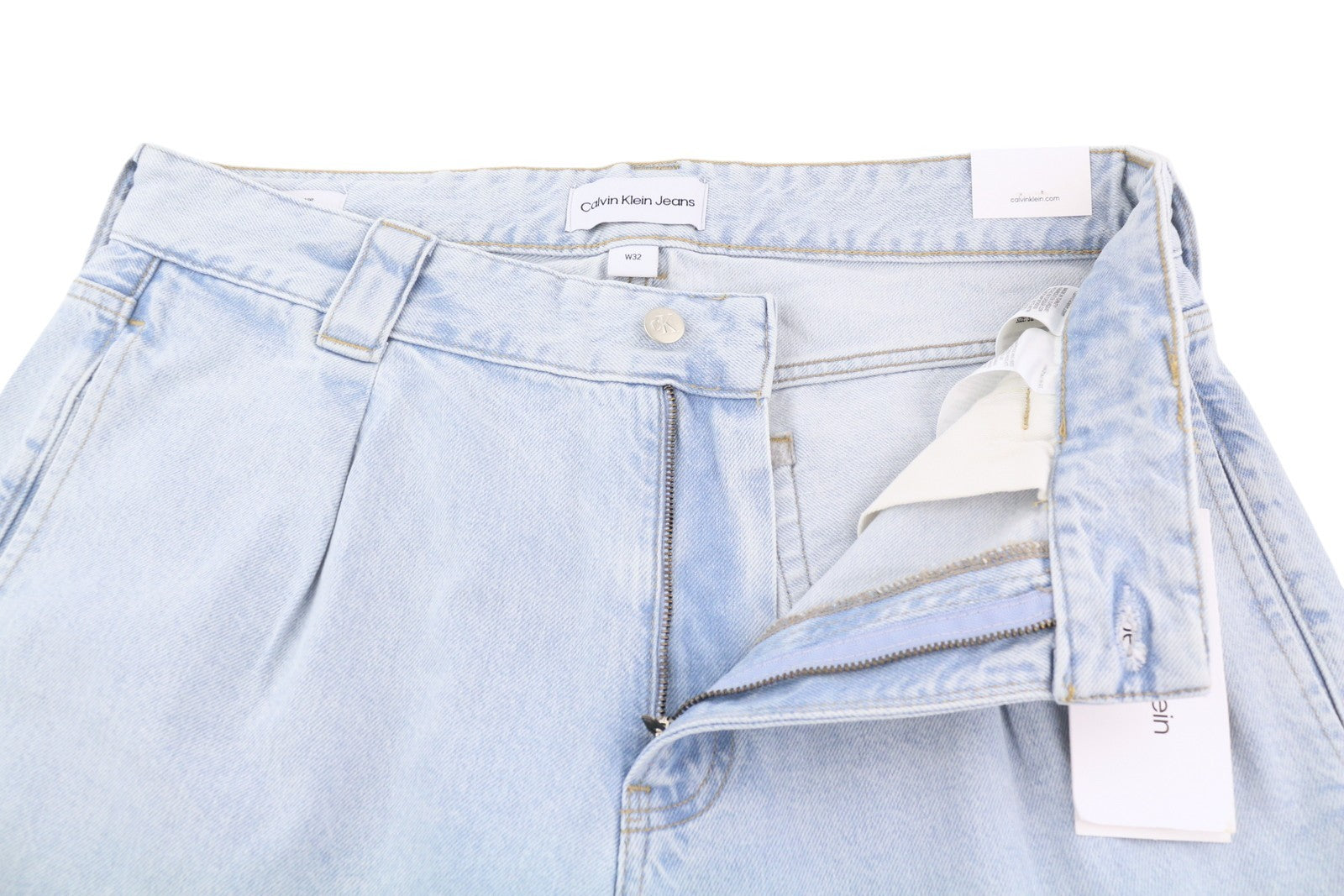 CALVIN KLEIN 90-ųjų laisvi klostuoti vyriški džinsai W32 su skalbtos mėlynos spalvos plačiomis užtrauktukais, rekomenduojama kaina – 272 USD 