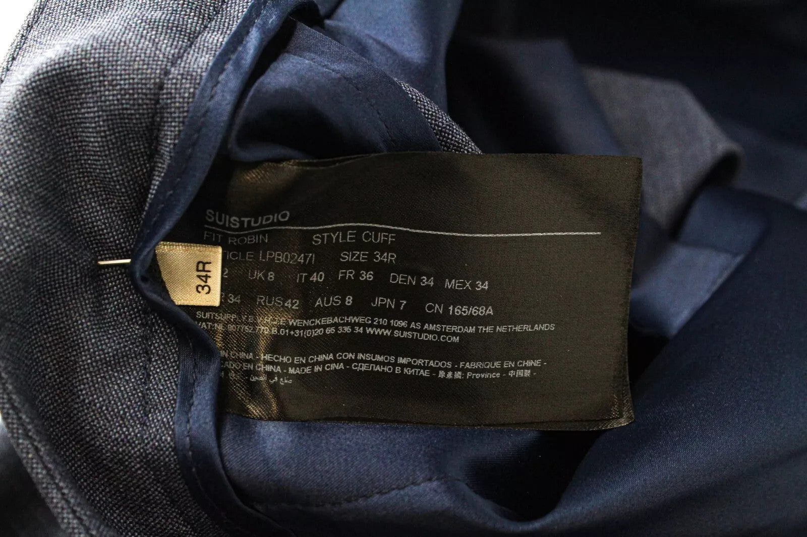 SUISTUDIO Robin moteriškos klostuotos mėlynos klasikinio kirpimo kelnės UK8R dydyje 