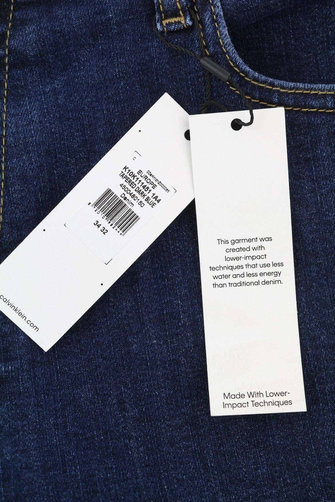 CALVIN KLEIN vyriški džinsai W34/L32 tamsiai mėlyni siaurėjantys tamprūs užtrauktukai su logotipu ir džinsiniu logotipu 