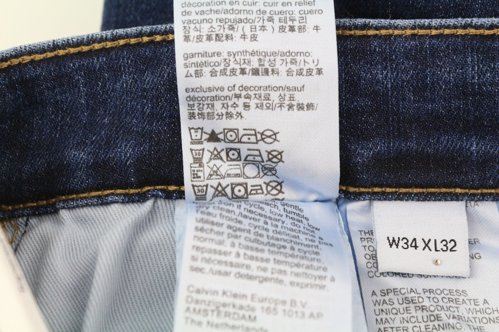 CALVIN KLEIN vyriški džinsai W34/L32 tamsiai mėlyni siaurėjantys tamprūs užtrauktukai su logotipu ir džinsiniu logotipu 