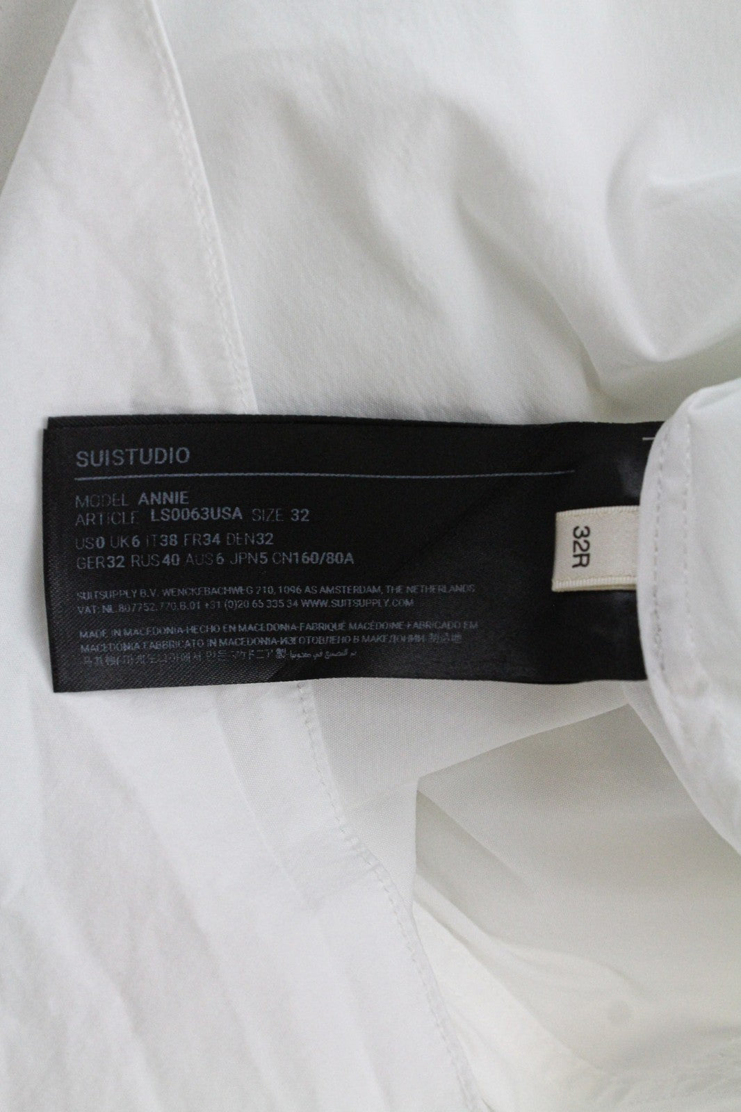 SUISTUDIO Annie moteriški marškinėliai UK6R balti tamprūs medvilniniai klostuoti ilgomis rankovėmis 