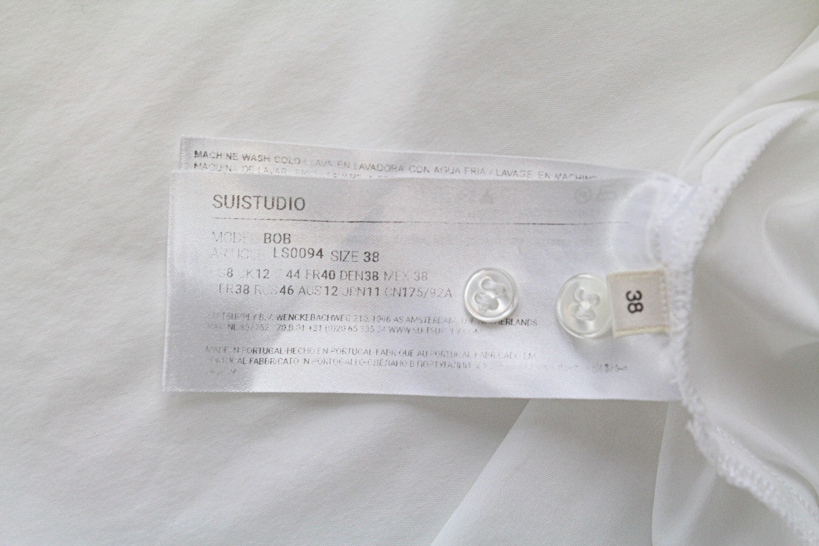 SUISTUDIO Bob moteriški marškinėliai, UK12, balti, tamprūs medvilniniai marškinėliai su atvirais pečiais, asimetrija 