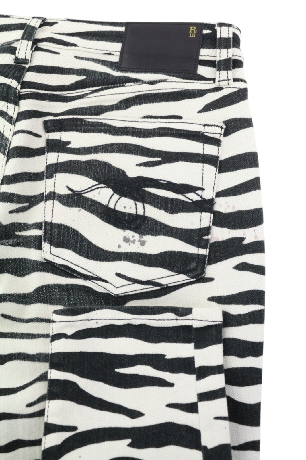 R13 Alison Skinny moteriški džinsai, 27 dydžio, su zebro raštu, užtrauktuku, laisvalaikio džinsinis logotipas. Rekomenduojama kaina – 599 €. 