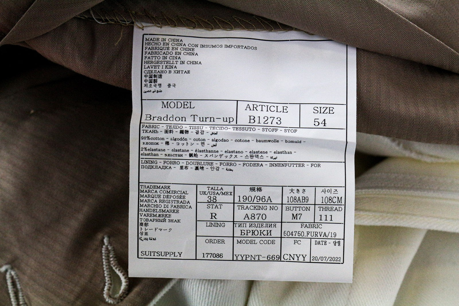 SUITSUPPLY Braddon vyriškos klostuotos kelnės iš UK38R, balkšvos, tamprios medvilnės 