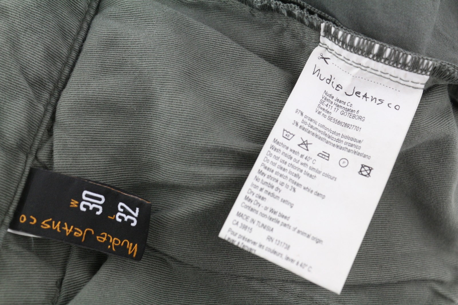 NUDIE JEANS Khaki spalvos plonos vyriškos kelnės W30/L32 Paloma Dust organinės spalvos chino užtrauktuku 