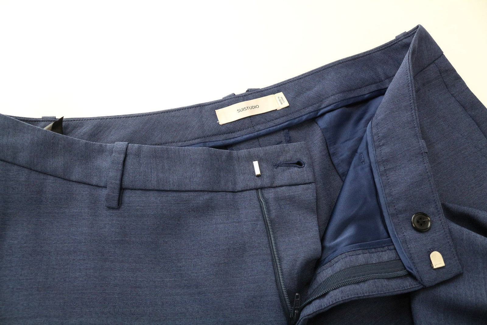 SUISTUDIO pilkos moteriškos kelnės UK14S mėlynos plonos melanžo grynos vilnos plokščia priekine dalimi 