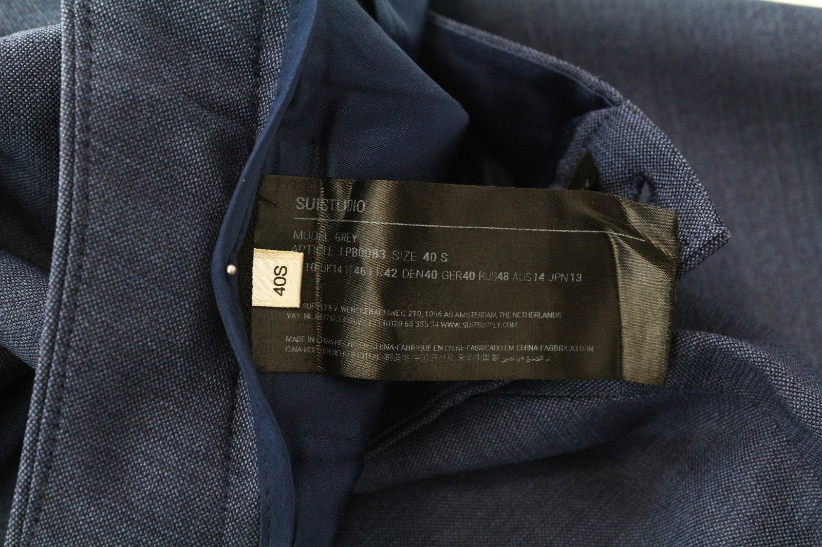 SUISTUDIO pilkos moteriškos kelnės UK14S mėlynos plonos melanžo grynos vilnos plokščia priekine dalimi 