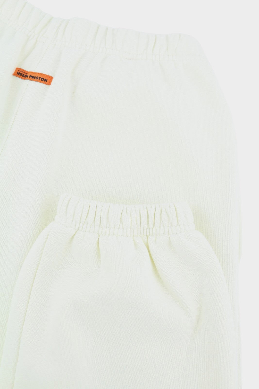 HERON PRESTON Nekilnojamojo turto moteriškos kelnės S dydžio baltos sportinės kelnės su logotipu priekyje RRP 399 € 