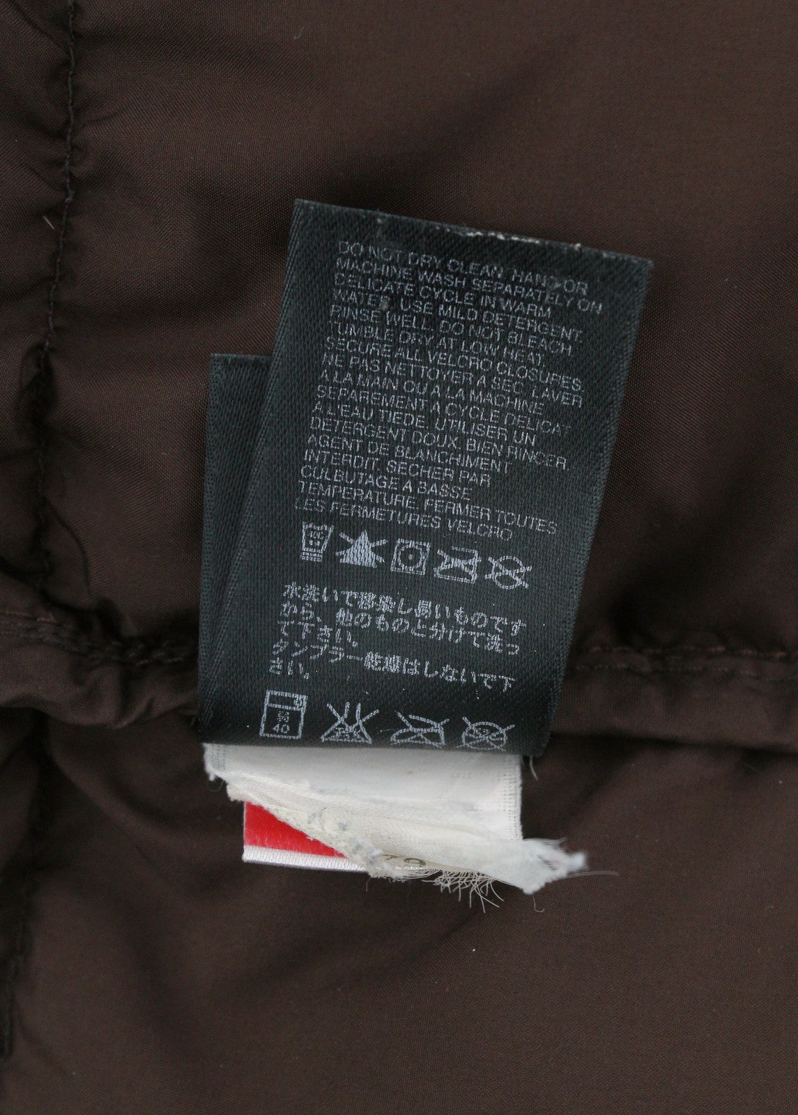 „THE NORTH FACE“ moteriška striukė S ruda 600 pūkuota dygsniuota aukšta apykakle, vidutinio ilgio 