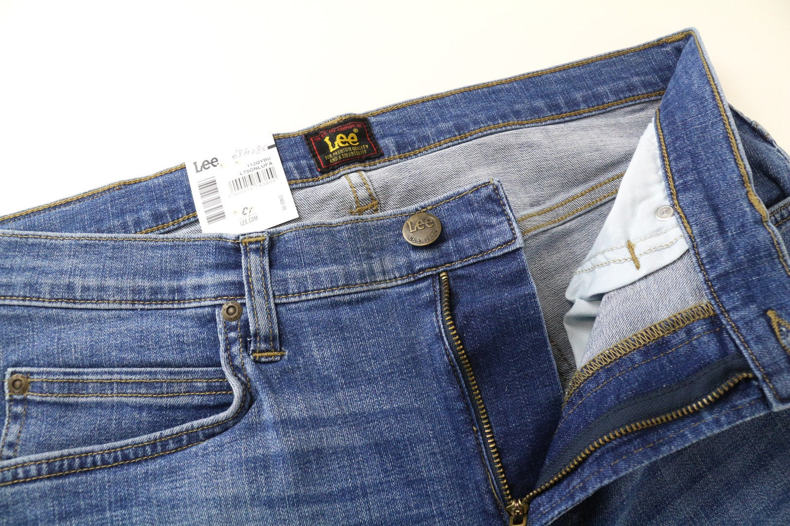 LEE Rider trumpinti vyriški džinsai W32/L34 vidutinio mėlynumo, tamprūs, ploni, klasikinio stiliaus, su užtrauktuku 