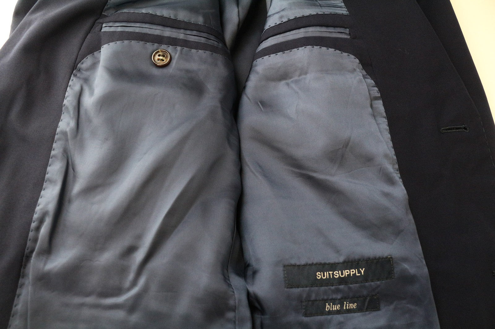 „SUITSUPPLY Napoli Blue Line“ vyriškas švarkas, UK38R, tamsiai mėlynas, vieneilis, grynos vilnos 