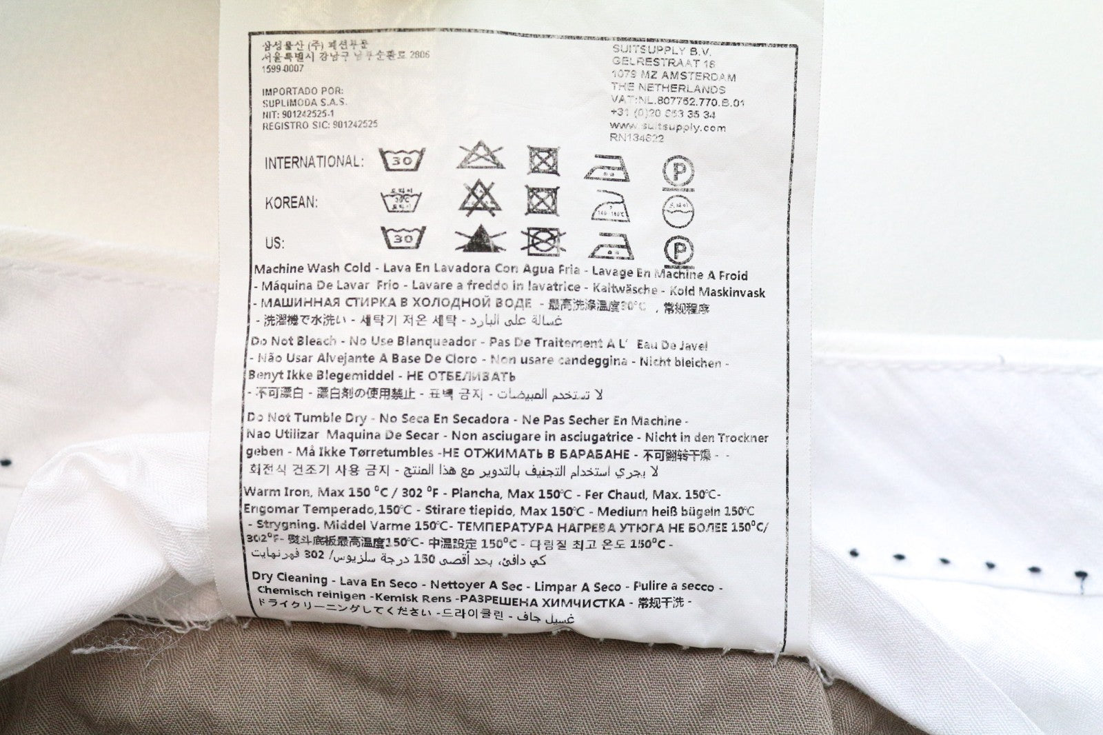 SUITSUPPLY Braddon vyriškos kelnės, UK42R, balkšvos, tamprios medvilnės kelnės su atlenkiamu apvadu 