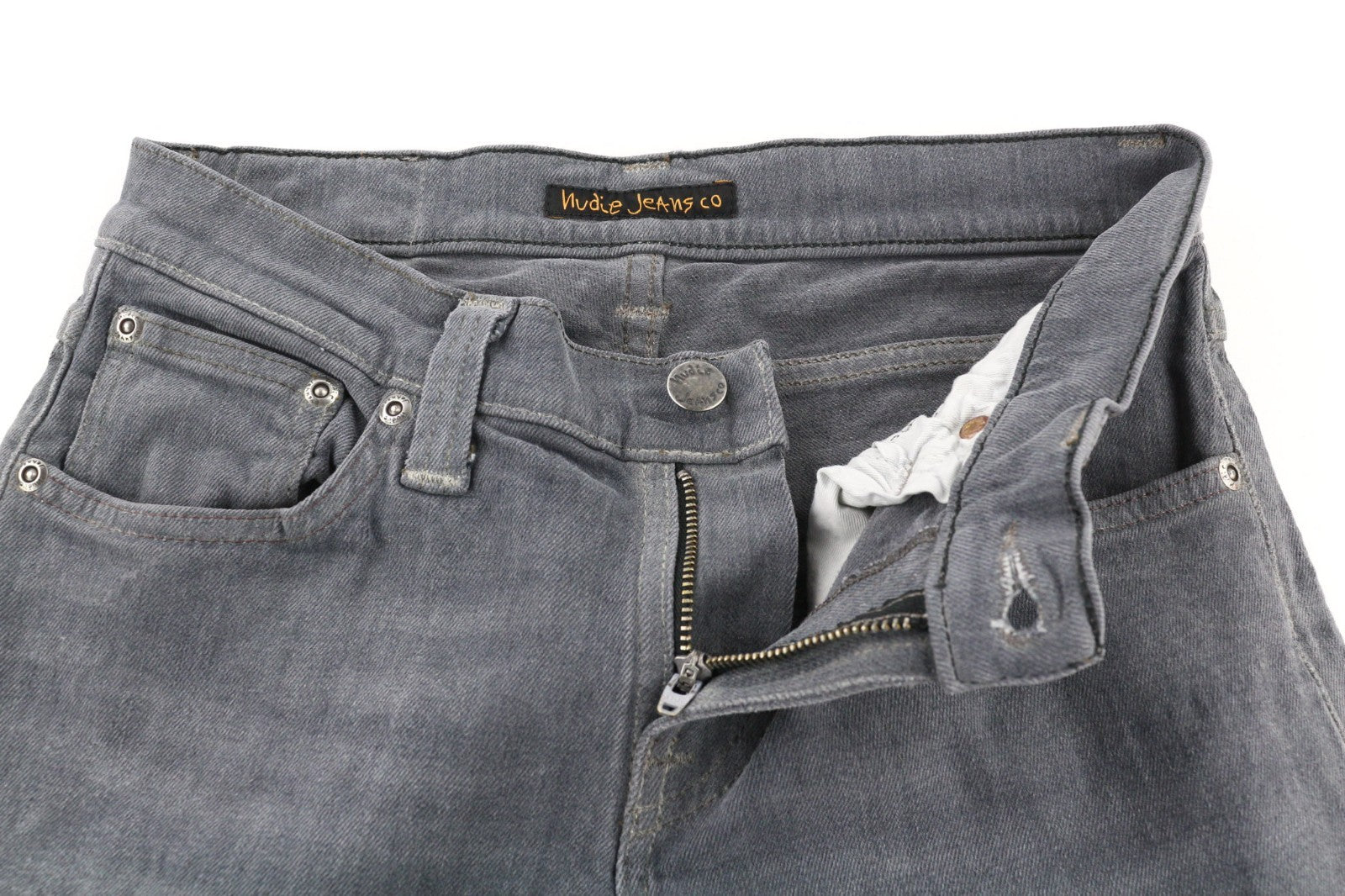 NUDIE JEANS aptempti ilgi moteriški džinsai W26/L34 tamsiai pilki, ploni, ekologiški 