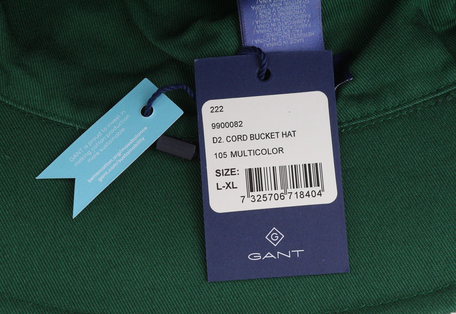 GANT virvelinė kibiro formos vyriška kepurė su L/XL dydžio daugiaspalve medvilnine priekine logotipu ir pamušalu. 