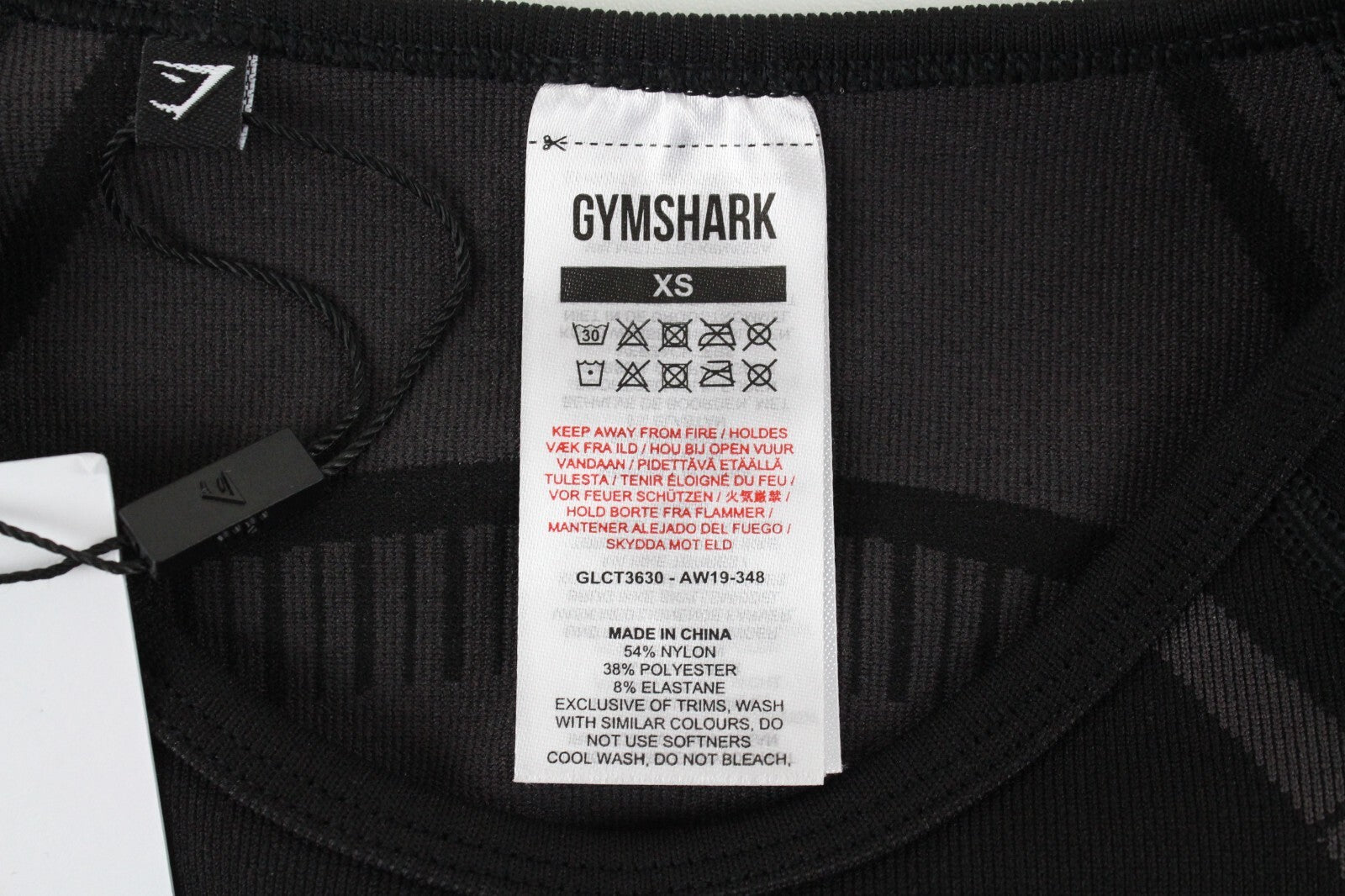 GYMSHARK Geo moteriški marškinėliai XS dydžio, juodi, ilgomis rankovėmis, trumpinti, tamprūs sportiniai marškinėliai 